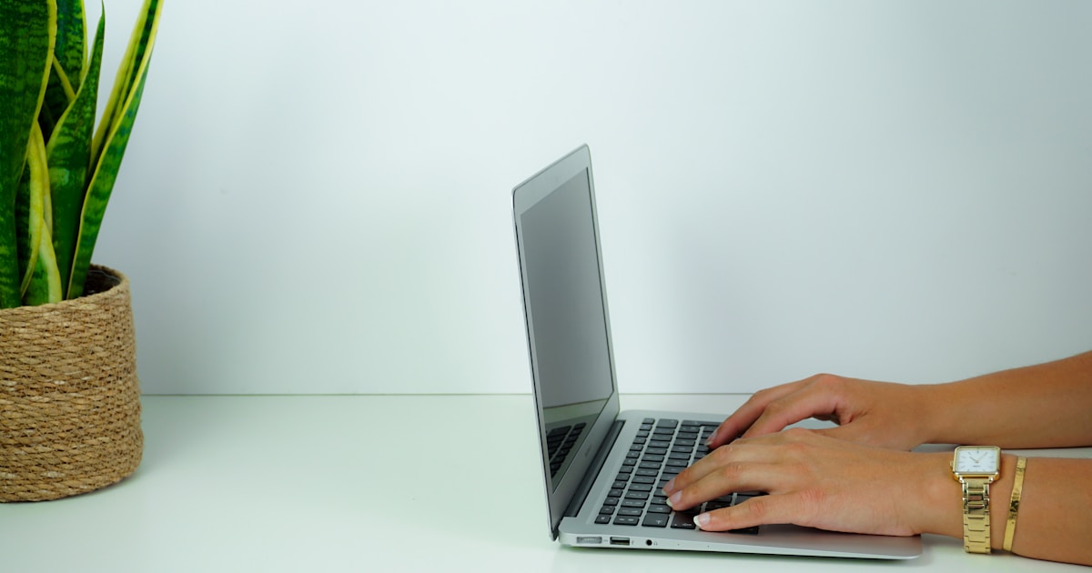 Future of Work with AI: How IT Pros Can Stay Relevant 2 person using macbook pro on white table