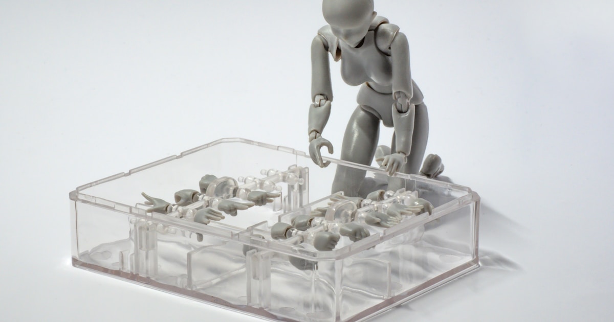 a small plastic man standing on a table