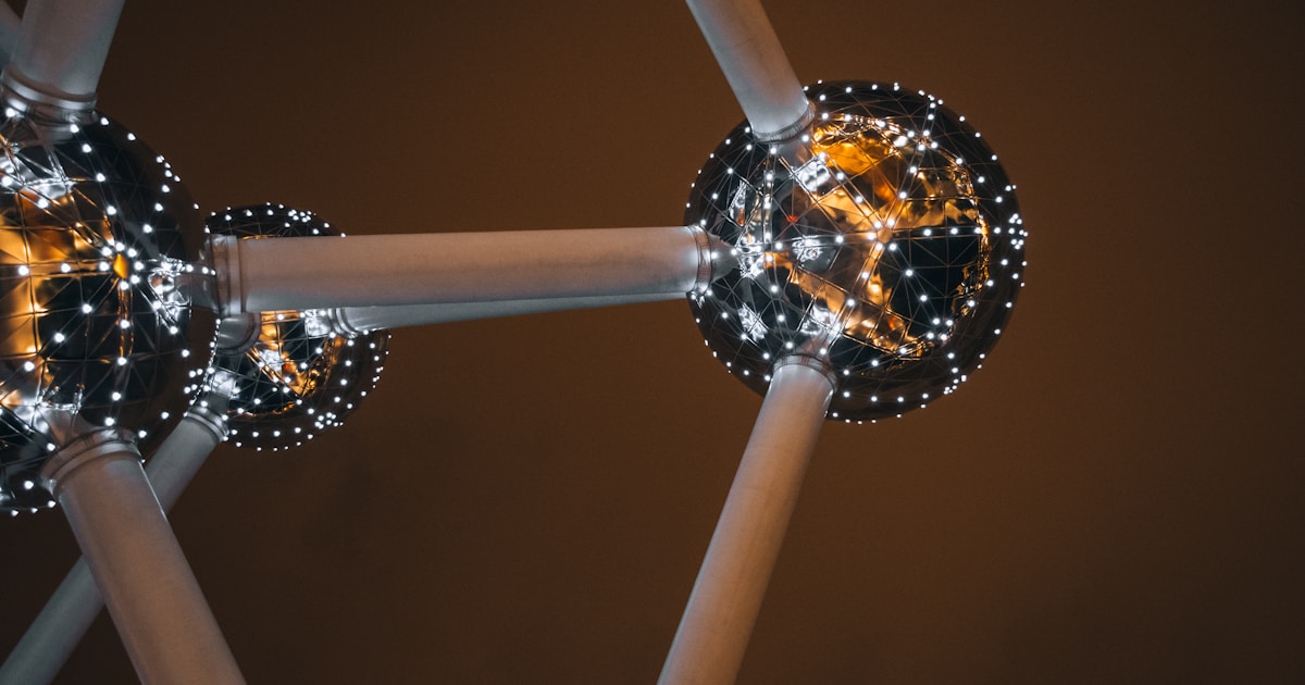 Abstract molecular structure with glowing spheres and reflective spheres.