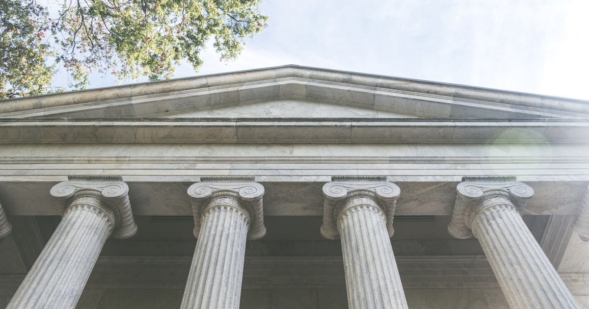 What is Money Laundering? A Beginner's Guide to How Dirty Money Becomes Clean in 2026 5 a close up of the top of a building with columns