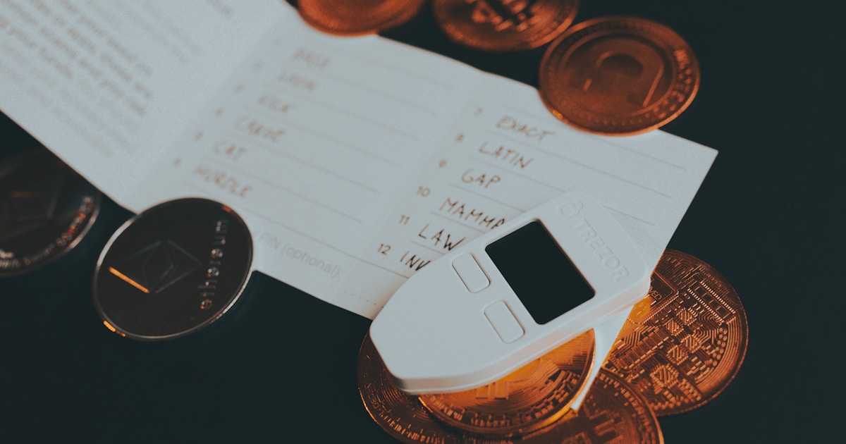 a cell phone sitting on top of a pile of coins