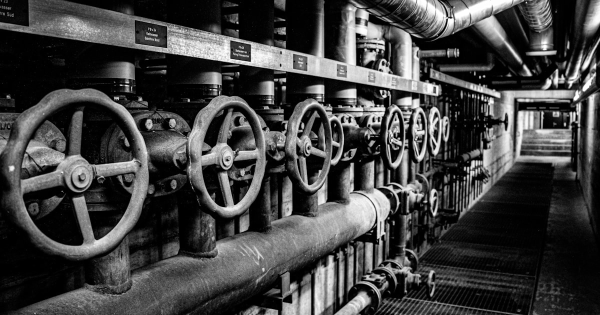 How Ai Is Powering Business Intelligence &Amp; Data-Driven Decisions 4 Industrial valves and pipes in a dark corridor.