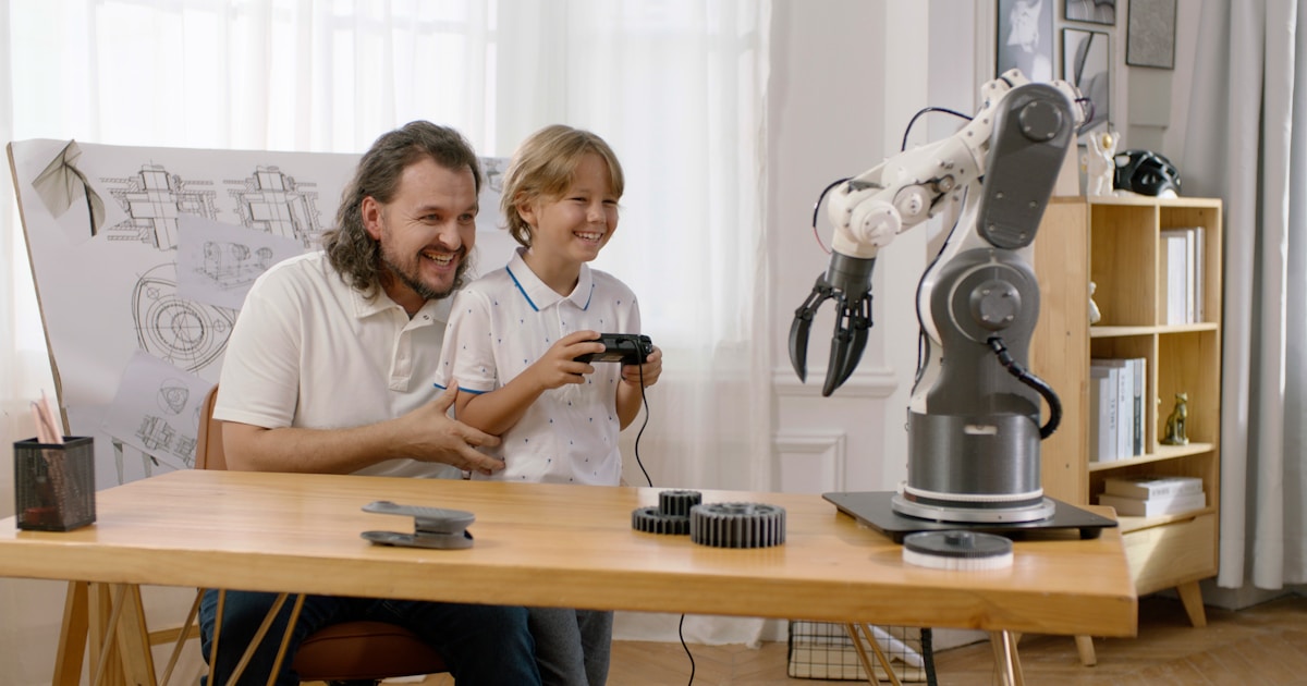 A man and a child are sitting at a table