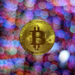 round gold-colored Bitcoin illustration