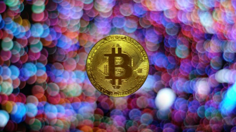 round gold-colored Bitcoin illustration