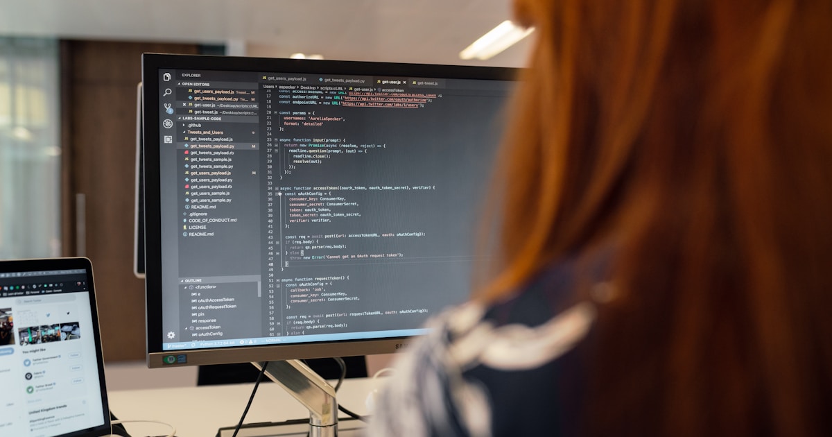 Top AI Tools Every IT Professional Should Learn in 2026 1 woman in black and white jacket sitting in front of computer monitor