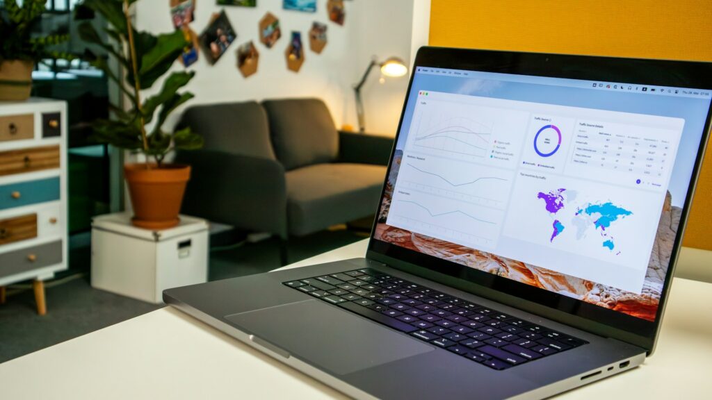 a laptop computer sitting on top of a white table