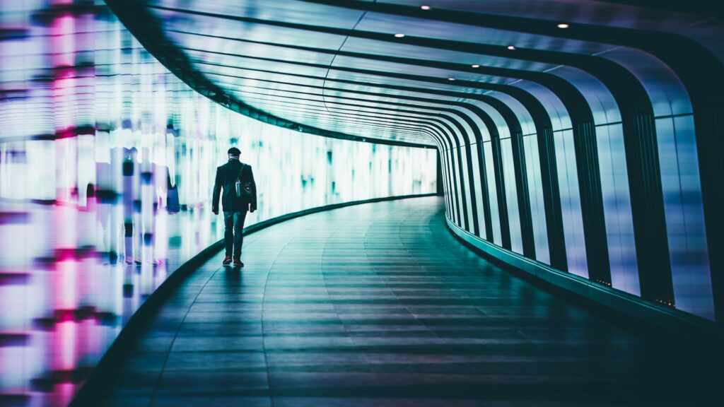 person walking along corridors ]